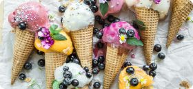 9 ice cream cones with blueberries